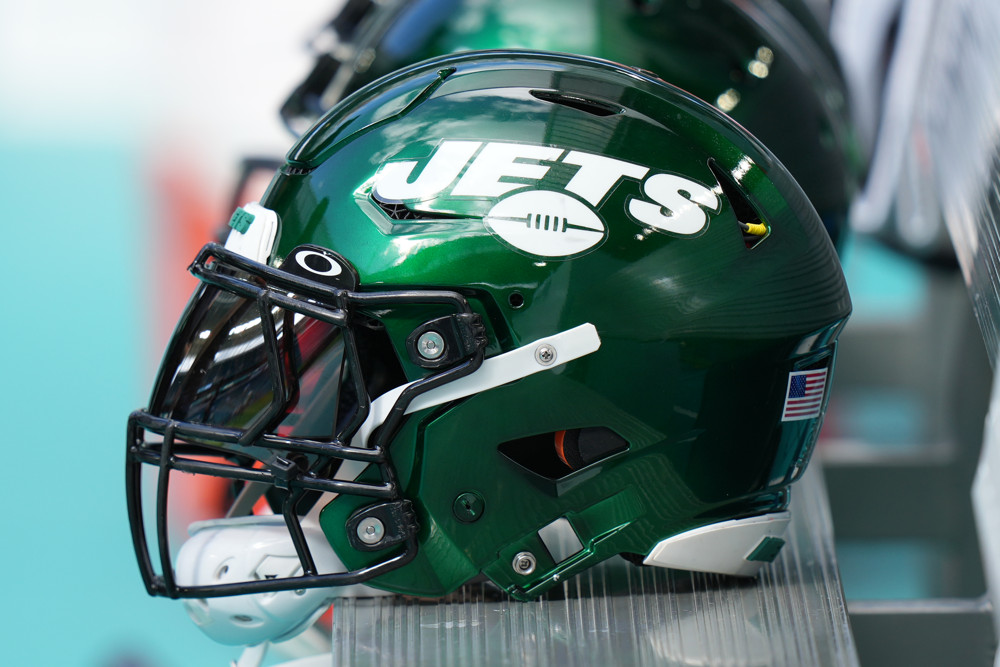 New York Jets helmet resting on the bench. 