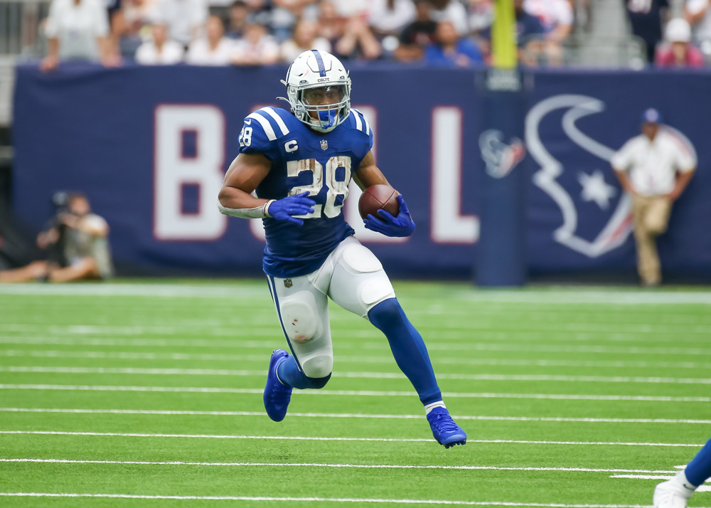 Jonathan Taylor runs the ball against the Texans