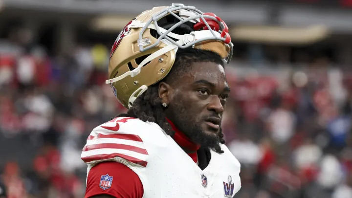 Brandon Aiyuk with his helmet resting on top his head. 