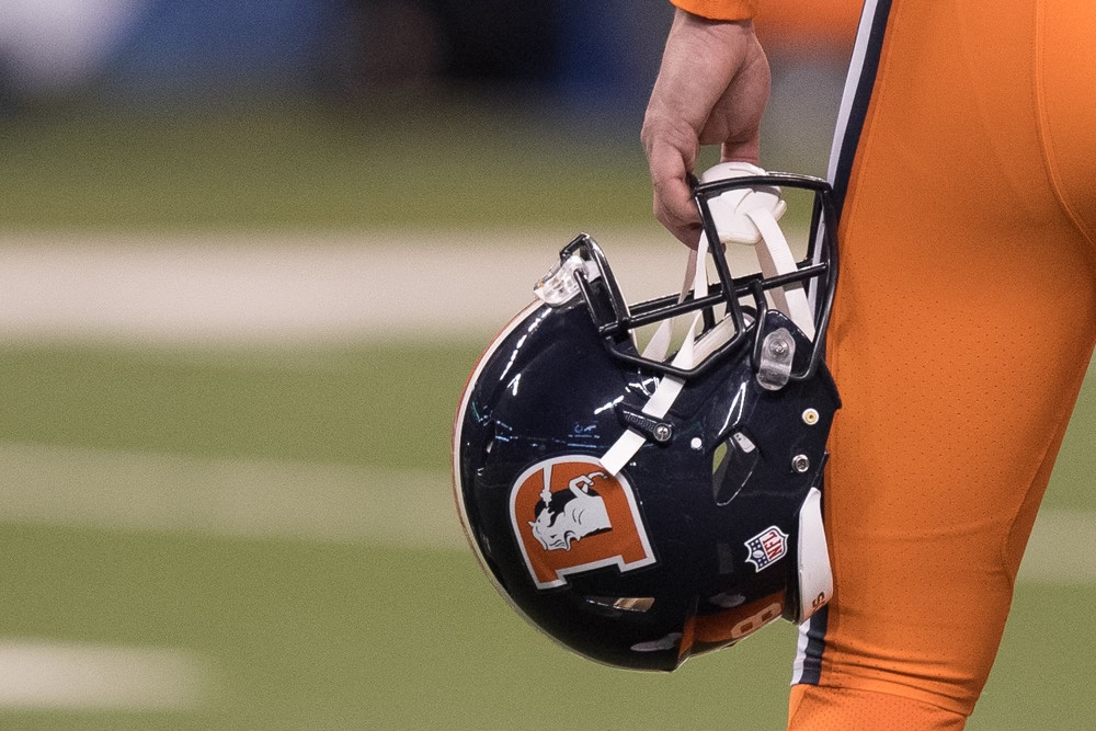 Denver Broncos Helmet held by player