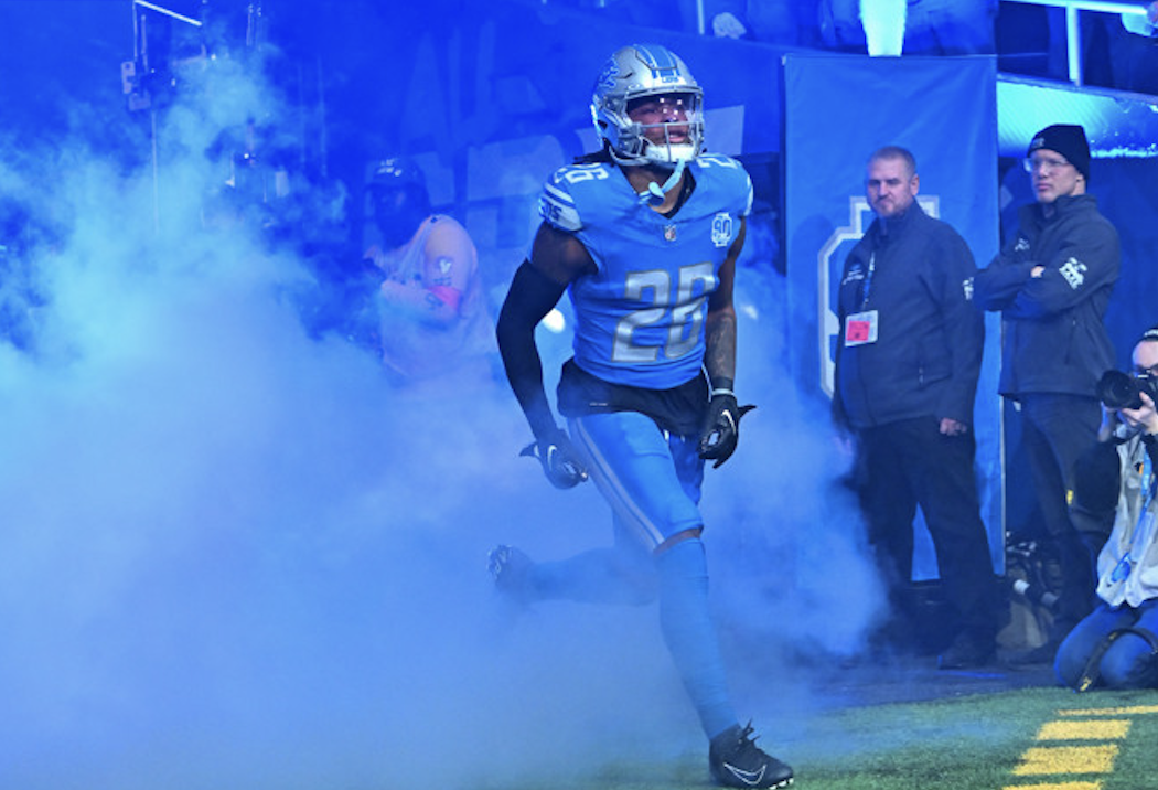 Jahmyr Gibbs running out of the tunnel