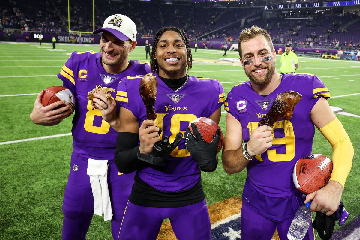 Kirk Cousins with teammates after Thanksgivings night game